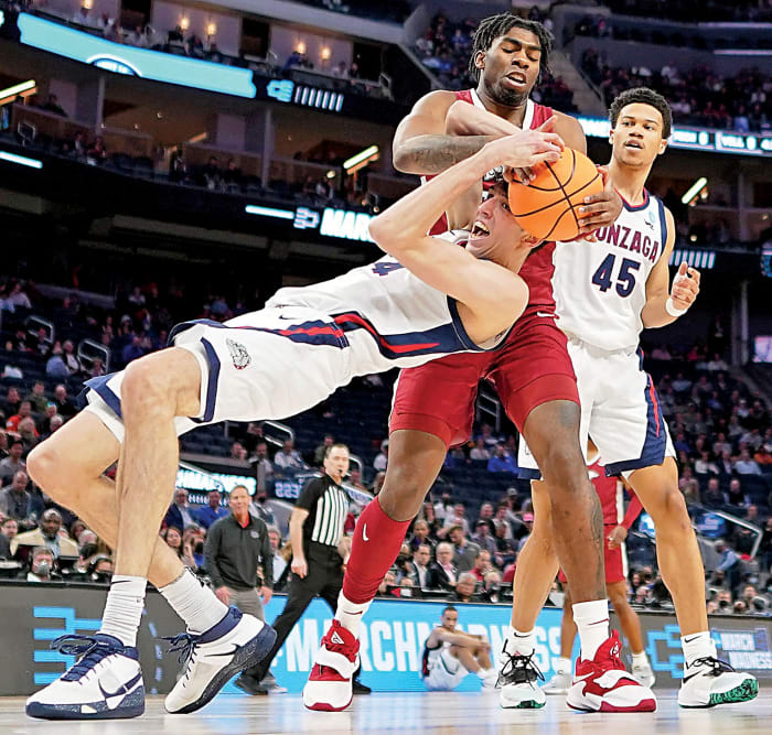 Gonzaga Bulldogs center Chet Holmgren (34) battles for the ball against Arkansas Razorbacks forward Kamani Johnson (20) during the first half in the semifinals of the West regional. The win sets up a rematch of the 1994 national championship game between Duke and Arkansas in the Elite 8 in what is Blue Devils' coach Mike Krzyzewski's final season.